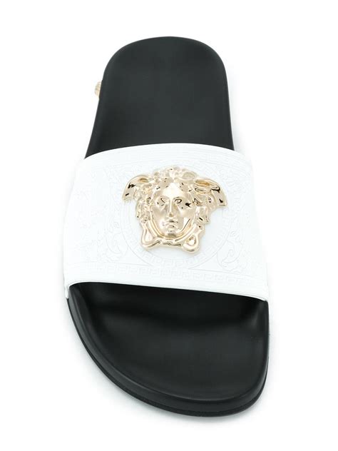 white Versace pool slides